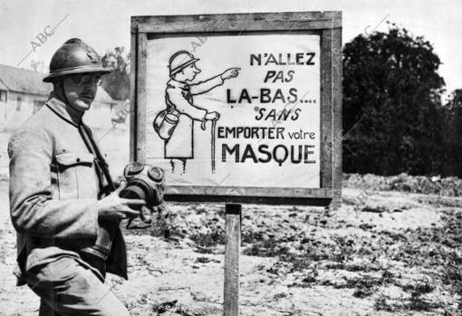 An Original War poster.  'do not go there without wearing the mask against asphyxiating gases', notice placed in a French position