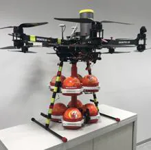 Drone equipped with balls of dry chemical powder