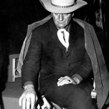 John Wayne, playing chess on a break from filming