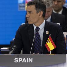 Pedro Sánchez, with the flag upside down.